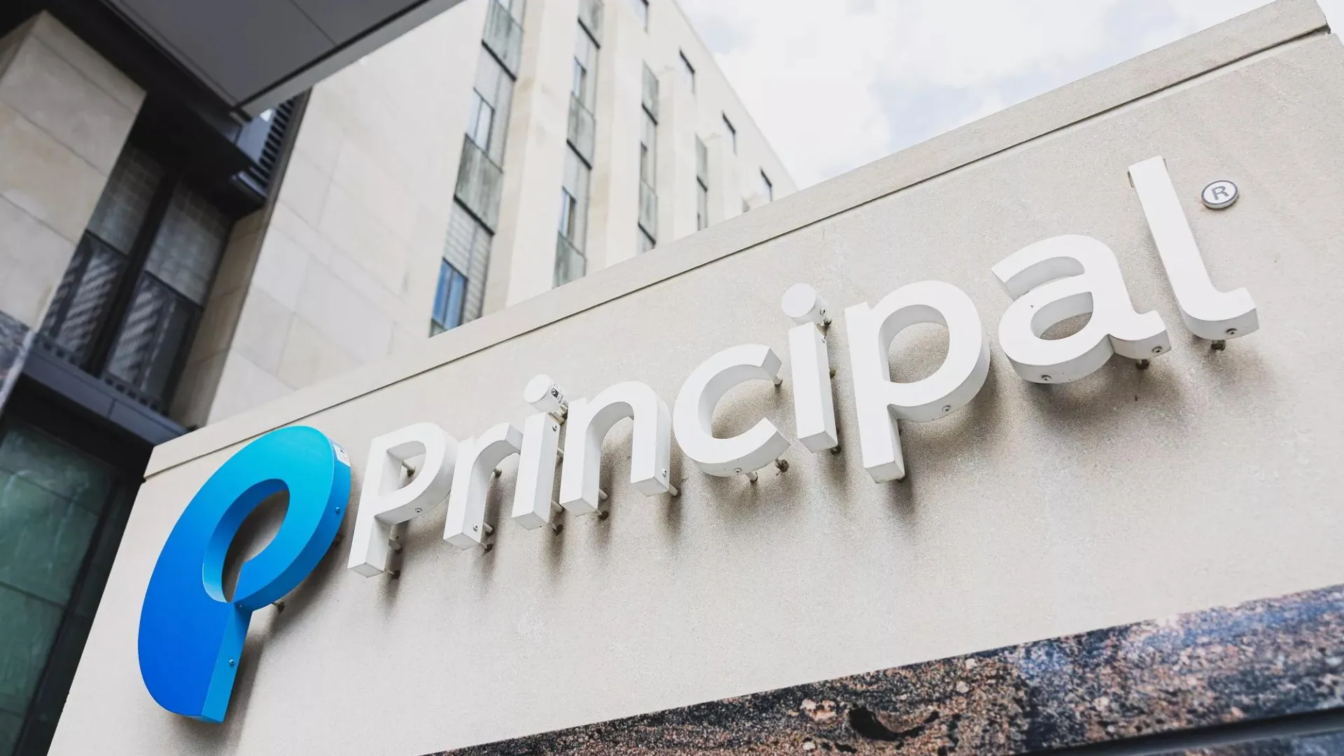 An upward view of the Principal Financial Group campus exterior signage.