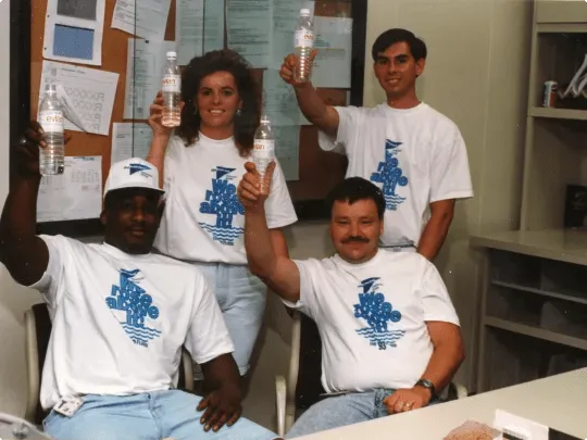 Principal employees in tshirts commemorating the 1993 flood